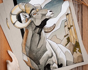 May include: A watercolor painting of a bighorn sheep with large horns, standing against a backdrop of a mountain range. The sheep is depicted in a stylized, geometric style, with shades of gray, brown, and white.