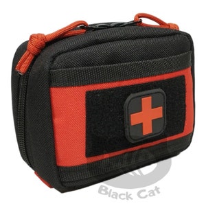 May include: Black zippered pouch with a red and black first aid patch. The pouch has a red trim and a black zipper. The pouch is made of a durable nylon material.
