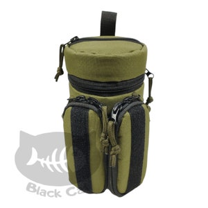 May include: A green canvas water bottle holder with black zippered pockets and a black strap.