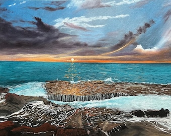 May include: A painting of a seascape with a rocky outcropping in the foreground. The sun is setting over the ocean, casting a golden glow on the water. The sky is a mix of blue, gray, and orange.