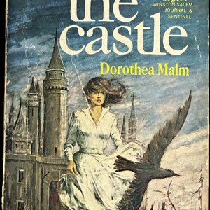 May include: Vintage paperback book cover for "To the Castle" by Dorothea Malm. The cover art features a woman in a white dress, a large black bird, and a castle in the background. The book is published by Ace Star.