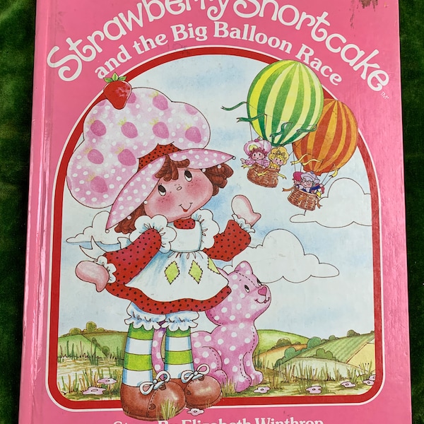 Strawberry Shortcake and the Big Balloon Race by Elizabeth Winthrop. Pictures by Pat Sustendal. Hardcover. Parker Brothers, 1983.