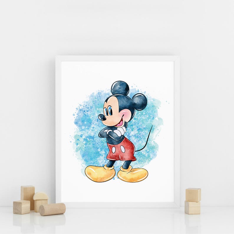 May include: Watercolor print of Mickey Mouse in a white frame. Mickey Mouse is depicted with a black body, red shorts, yellow shoes, and white gloves. The background features blue watercolor splashes. The artwork is displayed on a white surface.