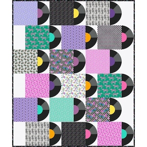 May include: A patchwork quilt featuring vinyl records with colourful album covers. The covers display various patterns, including geometric shapes, animal prints, and floral designs. The records have coloured labels, and the quilt is bordered with a black and white pattern.