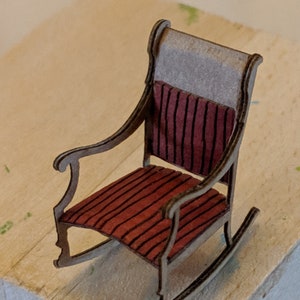 Quarter inch upholstered rocking chair