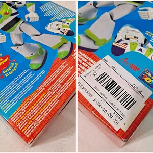 May include: A plastic action figure of Buzz Lightyear from the Toy Story franchise. The figure is wearing a white and green spacesuit with a blue helmet. The figure is holding a laser gun in his right hand. The figure is standing on a blue and white box with the words "The Original Buzz Lightyear" printed on it. The box also has a barcode and the words "I'm a Thinking Toy" printed on it.