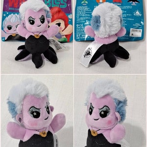 May include: A purple and blue Ursula plush toy from Disney's The Little Mermaid. The plush toy is wearing a black dress and has a purple shell necklace. The toy is part of a Disney Parks exclusive collection called "Wishables".