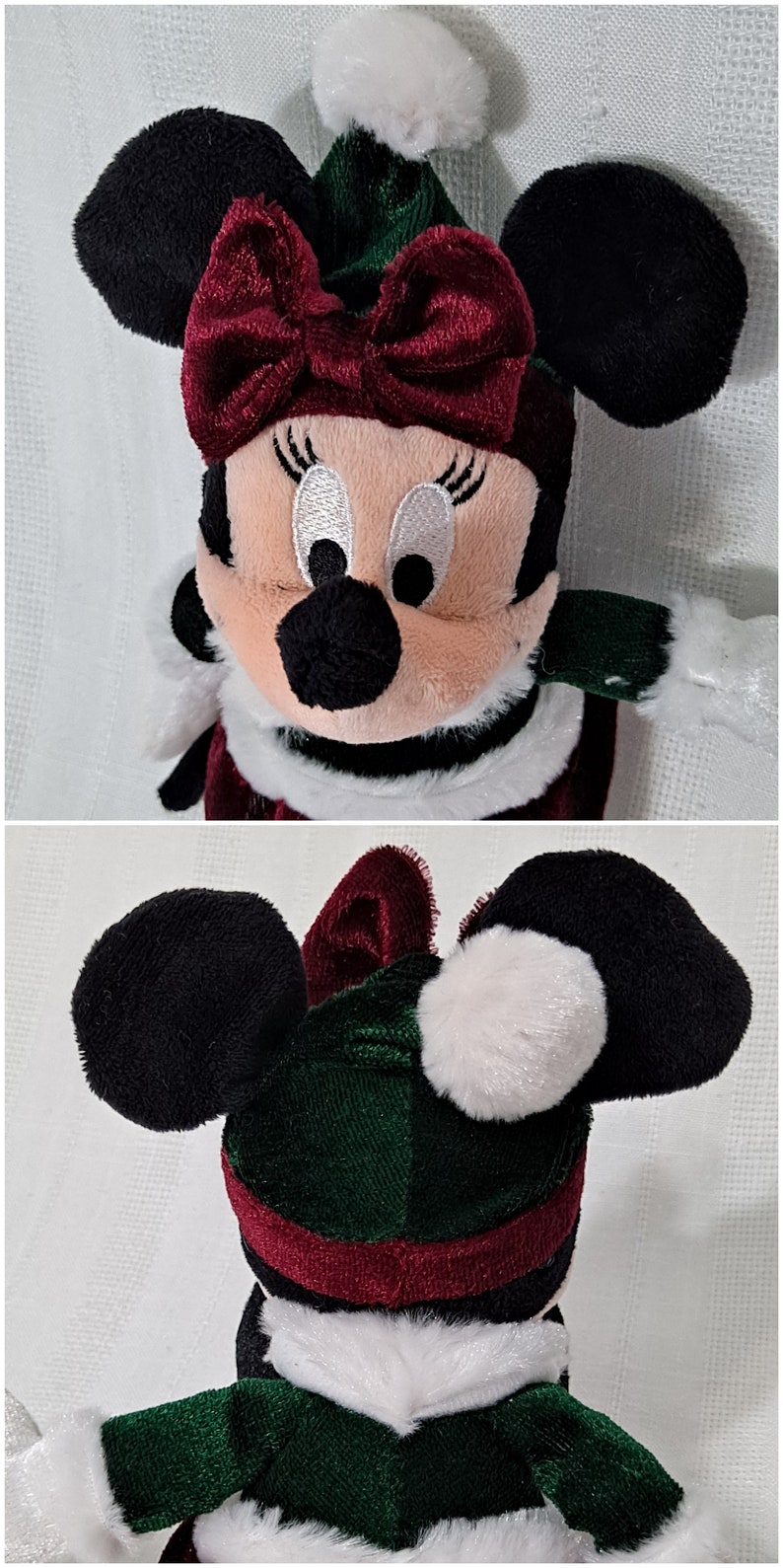 May include: A plush toy of Minnie Mouse dressed in a green and red Christmas outfit. She is wearing a red bow, a green hat with a white pom-pom, and a white fur trim around her neck.