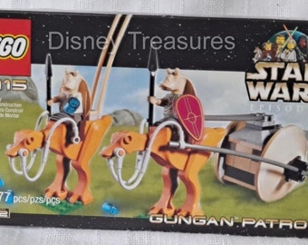 May include: LEGO Star Wars Episode I Gungan Patrol set 7115, featuring two Gungan warriors riding on two orange and brown  wheeled creatures. The box has a black background with the Star Wars logo and the words "Gungan Patrol" in white.