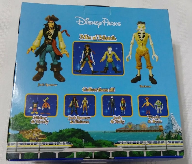 May include: A blue box with a picture of Jack Sparrow and the Skeleton from Pirates of the Caribbean. The box says "Disney Parks Mix 'n Match" and "Collect them all". There are smaller pictures of other Disney characters on the box, including Mickey Mouse and Goofy, Jack Sparrow and the Skeleton, Jack Skellington and Sally, and Woody and Buzz Lightyear.