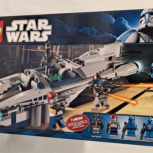 May include: A Lego Star Wars Cad Bane's Speeder set with 318 pieces. The set includes a blue and gray speeder, a Cad Bane minifigure, and several other minifigures. The box is blue and features a picture of the speeder and the minifigures.