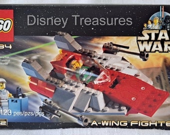 May include: A Lego Star Wars A-Wing Fighter building set with 123 pieces. The box features a red, white, and gray spaceship with a clear cockpit. The box also features the Lego logo, the Star Wars logo, and the text "Disney Treasures".