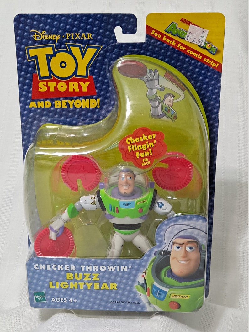 May include: Toy Story action figure of Buzz Lightyear in a green and white spacesuit, holding a red checker. The figure is packaged in a clear plastic box with a green and blue background. The box has the words "Checker Throwin' Buzz Lightyear" and "Ages 4+" printed on it.