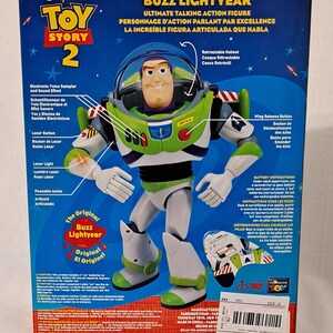 May include: Buzz Lightyear action figure from the Toy Story 2 movie. The figure is green, white, and purple. It has a retractable helmet, laser light, and poseable joints. The packaging features the original Buzz Lightyear logo.
