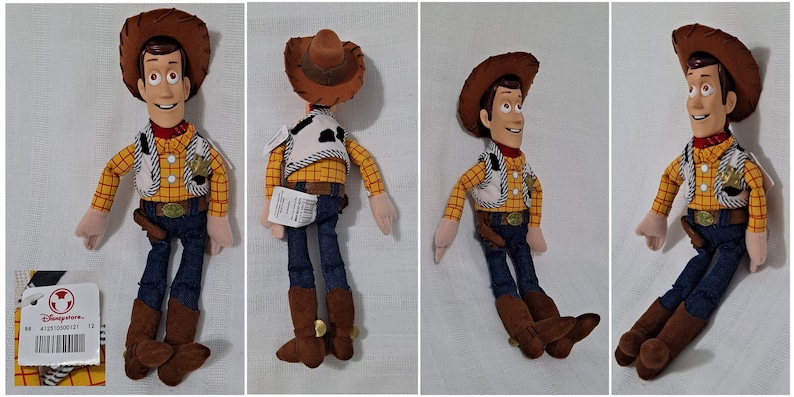 May include: A plush toy of Woody from the Toy Story franchise. Woody is wearing his signature cowboy hat, vest, and jeans. He has a friendly expression and is standing with his arms at his sides.
