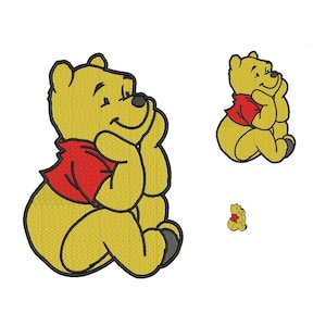 May include: A yellow cartoon bear with a red scarf sitting with its chin on its paws. The bear is looking to the right. There are two smaller versions of the bear in the background.