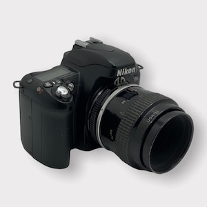 Nikon F75 35mm Film Camera With A Micro-NIKKOR 55mm f/3.5 Lens