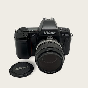 Nikon F-801s professional vintage film camera w/Nikon micro Nikkor 55mm F3.5 lens in very good condition.