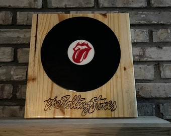 Custom vinyl record wall art created record with pine wood and Rolling Stones tongue epoxied over vinyl record with artist burnt onto wood