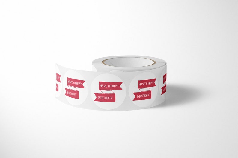 May include: A roll of white circular adhesive stickers featuring a red banner graphic with the text HAVE A HAPPY BIRTHDAY printed in white. The stickers are arranged in a continuous line on a backing paper roll, showing multiple repeating labels.