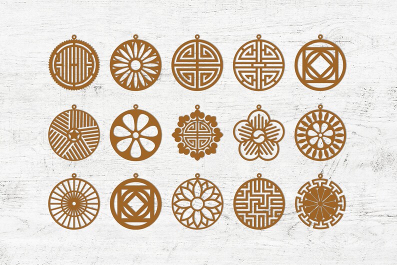 May include: Set of 16 brown laser cut ornaments with geometric and floral designs. The ornaments are circular and have a hole at the top for hanging.