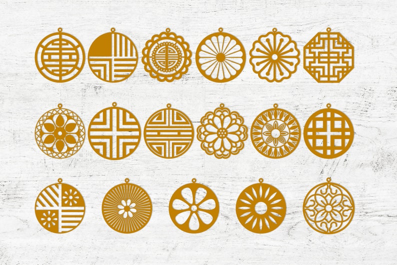 May include: Set of 18 gold-colored laser cut ornaments featuring geometric and floral designs. The ornaments are circular and have intricate patterns.