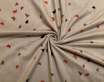 May include: Beige fabric with a repeating pattern of brown and orange butterflies.