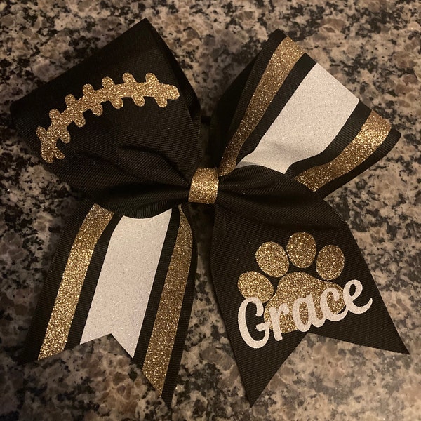 Cheer bow with football laces, Paw print cheer bow, Cheerleader bows for team, Custom cheer bow in your team colors. Great rec cheer bow.