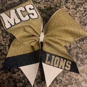 Cheer bow with name on stripe. Full glitter cheer bow with colored corners. Great competition cheer bow or dance bow. Cheer bows for squad.