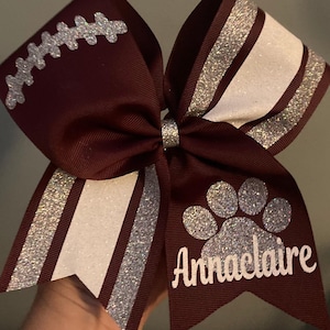 Football cheer bow with laces and pawprint. Burgundy, maroon cheer bow, Sideline cheer bow, custom team bows. Game day bows,
