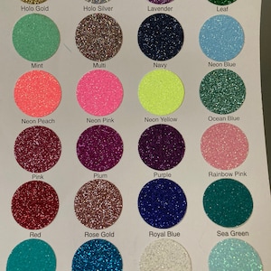 Pu&ograve; includere: Una tabella colori con 24 colori glitter, ciascuno in un campione circolare. I colori includono Holo Gold, Menta, Pesca Neon, Rosa, Rosso, Teal, Holo Argento, Multi, Rosa Neon, Prugna, Oro Rosa, Turchese, Lavanda, Blu Navy, Giallo Neon, Viola, Blu Reale, Bianco, Foglia, Blu Neon, Blu Oceano, Rosa Arcobaleno, Verde Mare e Tiff Blue.