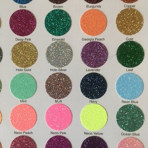 May include: A chart of 24 different glitter colors, each color is represented by a small circle of glitter. The colors include blue, brown, burgundy, copper, deep pink, emerald, Georgia peach, gold, holo gold, holo silver, lavender, leaf, mint, multi, navy, neon blue, neon peach, neon pink, neon yellow, ocean blue, pink, plum, purple, and rainbow pink.