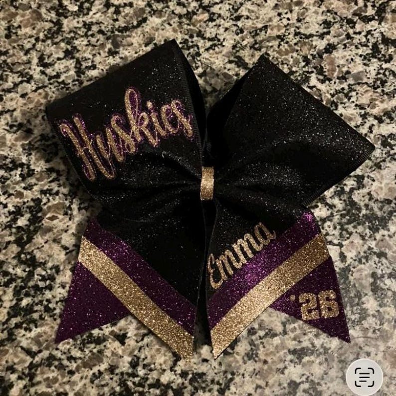 purple and black cheerleading bow