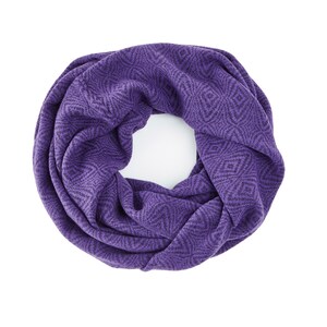 May include: A purple knitted infinity scarf with a geometric pattern.