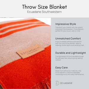 May include: Southwestern throw blanket with orange and white stripes. The blanket has a fringed edge and a leather tag that reads "ECUADANE A Lifetime of Comfort". The blanket is made of soft acrylic materials.
