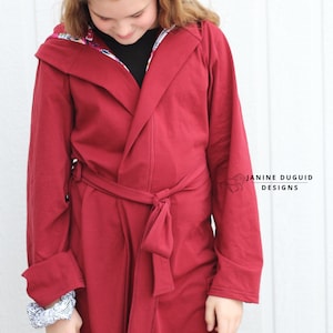 May include: A long, burgundy hooded robe with a tie belt. The hood is lined with a floral print fabric.