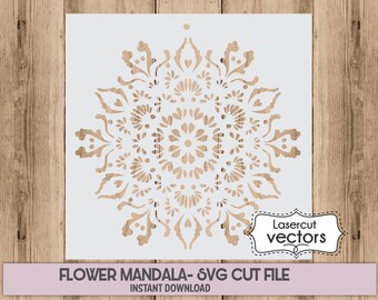May include: A white stencil featuring a floral mandala design with intricate cut-out details. The design includes floral and leaf patterns. The text "FLOWER MANDALA - SVG CUT FILE INSTANT DOWNLOAD" is displayed at the bottom. The words "Lasercut vectors" are in a white frame.