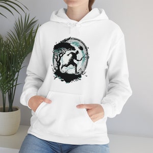 May include: White hoodie with a graphic print of a person running through a forest with a glowing circle around them.