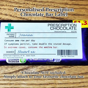 May include: A purple and white chocolate bar wrapper with a prescription label. The label says "Prescription Chocolate" and has a price of £1.35. The label also includes a patient name, Joanna, and a signature from Stuart xx.
