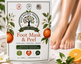 May include: A white pouch of Bulk Natural Products Foot Mask & Peel featuring a tree logo, orange illustrations, and text stating it exfoliates, smoothes, and renews. The label includes icons for all natural, handcrafted, and cruelty-free status.