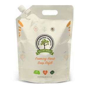May include: A white plastic pouch with a handle, labeled "Bulk Natural Products" and "Foaming Hand Soap Refill". The pouch has a spout for dispensing the soap and features a green leaf, a red heart, and a green leaf with a drop of water, indicating natural, vegan, and eco-friendly ingredients.