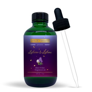 May include: A green glass bottle with a dropper, labeled "DREAM TERRACE presents Lilies & Lilac lilies & lilac fragrance oil 120 mL - 4 oz".