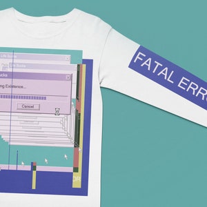 May include: White long-sleeve shirt with a blue and purple graphic of a computer error message that says "Deleting Existence..." and a blue stripe on the sleeve that says "FATAL ERROR".
