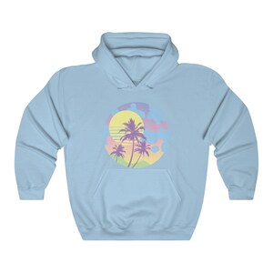 May include: A light blue hooded sweatshirt with a graphic of a sunset with palm trees in pastel colors.