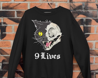 Sudadera espeluznante de Halloween con diseño de gato "9 vidas", gatita bruja, satánica, ocultismo y calavera gótica.
