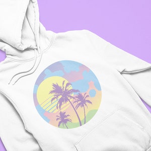 May include: White hoodie with a pastel colored graphic of palm trees and a sun on a pink, blue, and yellow background.