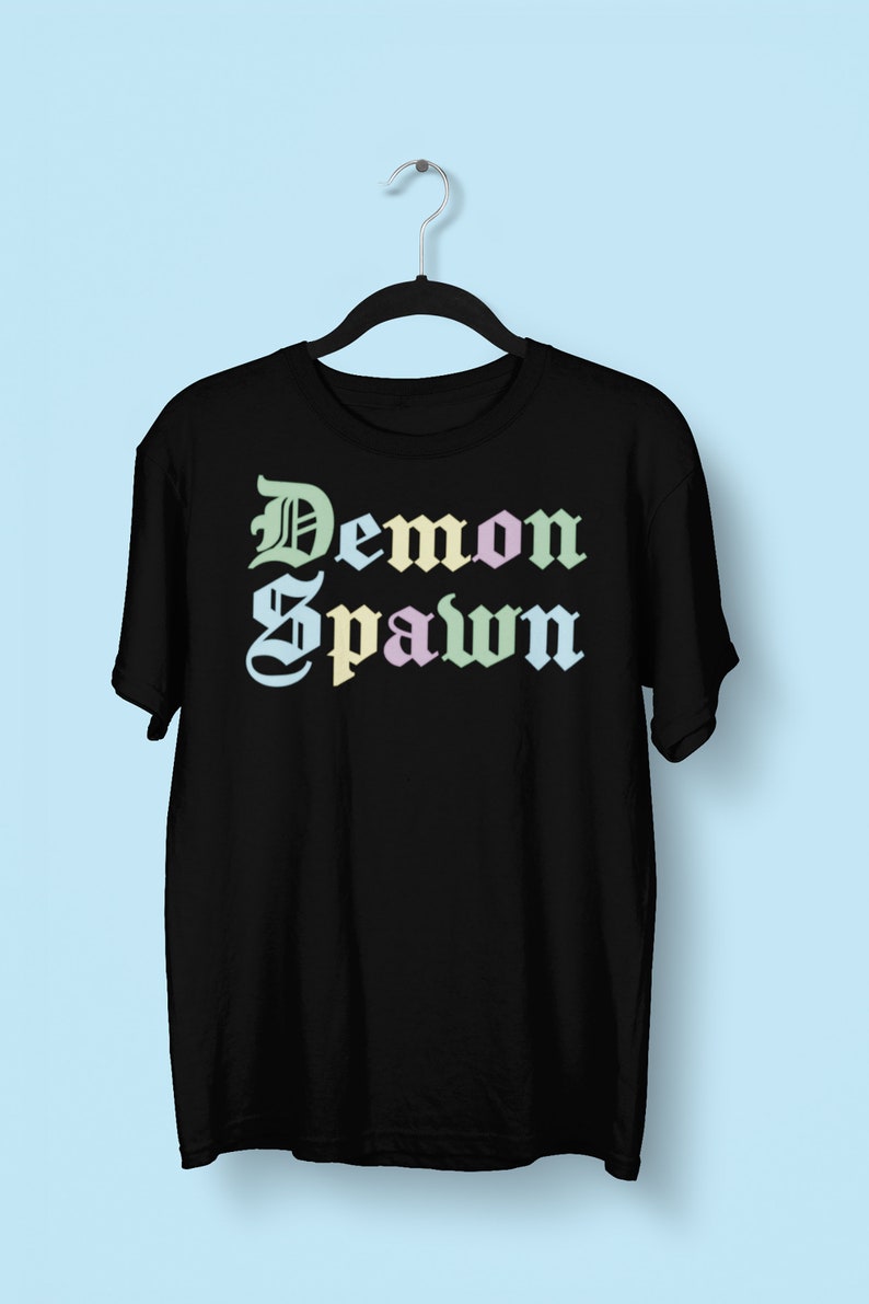 May include: Black t-shirt with the text "Demon Spawn" in a colorful gothic font.