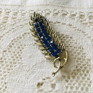 Blue stone brooch