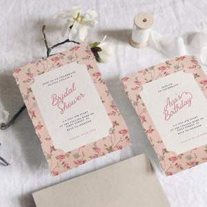 May include: Two floral patterned invitations with pink and white flowers. The top invitation says "Join us to celebrate Olivia Collin's Bridal Shower" and the bottom invitation says "Join us to celebrate Ava's Birthday".