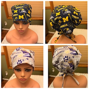 May include: A navy blue and yellow patterned scrub cap featuring the text "MICHIGAN" and the letter "M". The cap also features a football helmet graphic. A second cap is light gray with purple and white text that says "WASHINGTON HUSKIES".